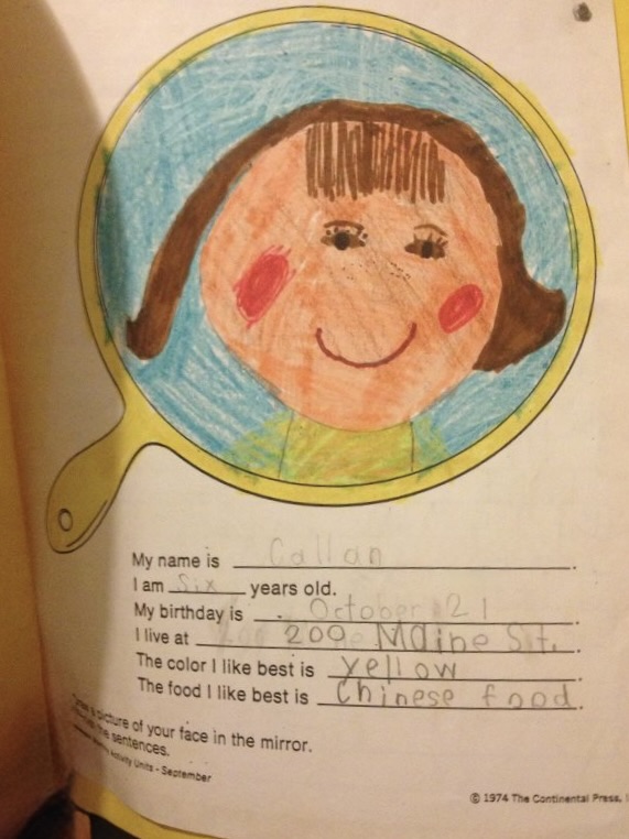 Self-portrait, age 5 — crayon on a school worksheet
